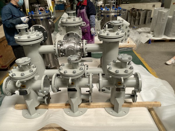 A strainer is a device used to remove larger particles